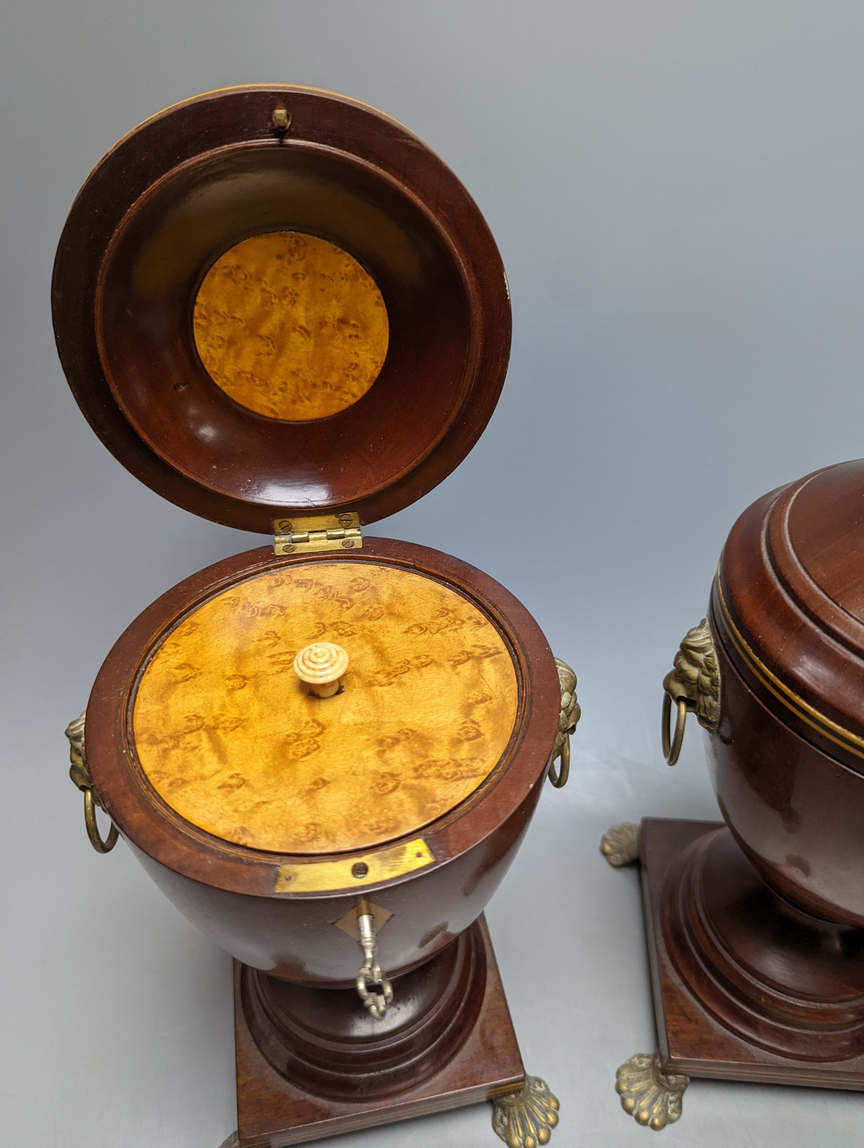 A pair of Sheraton-style mahogany urn-shape tea caddies, with brass mounts, 36cm.